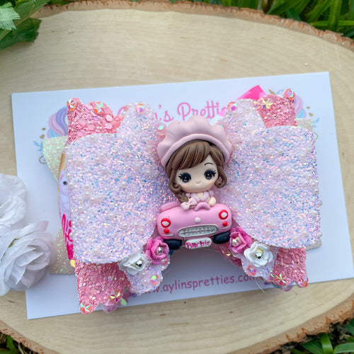 Doll in Car Movie Ribbon Bow