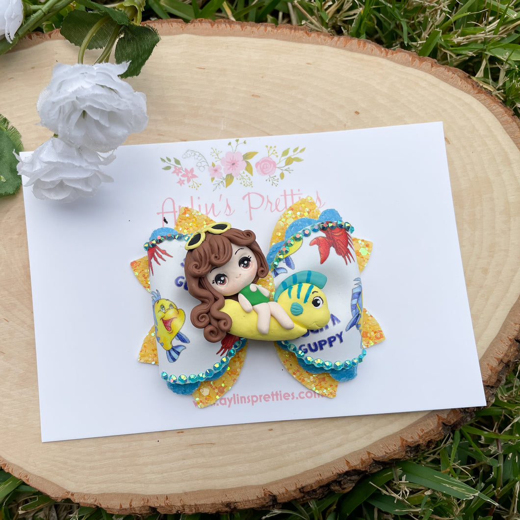 Girl on Yellow Fish Float
