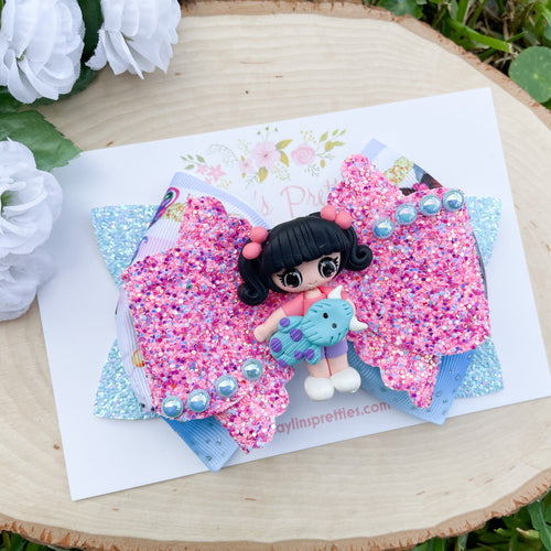 Girl Holding Blue Monster Ribbon Bow